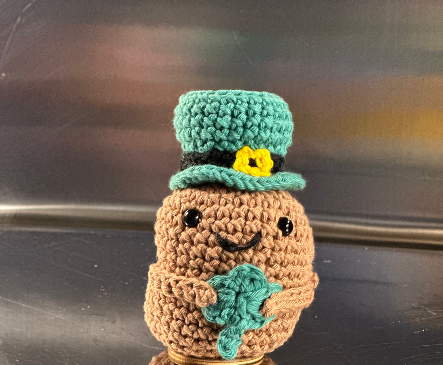 St Patricks Potato with Leprechaun hat and holding a shamrock