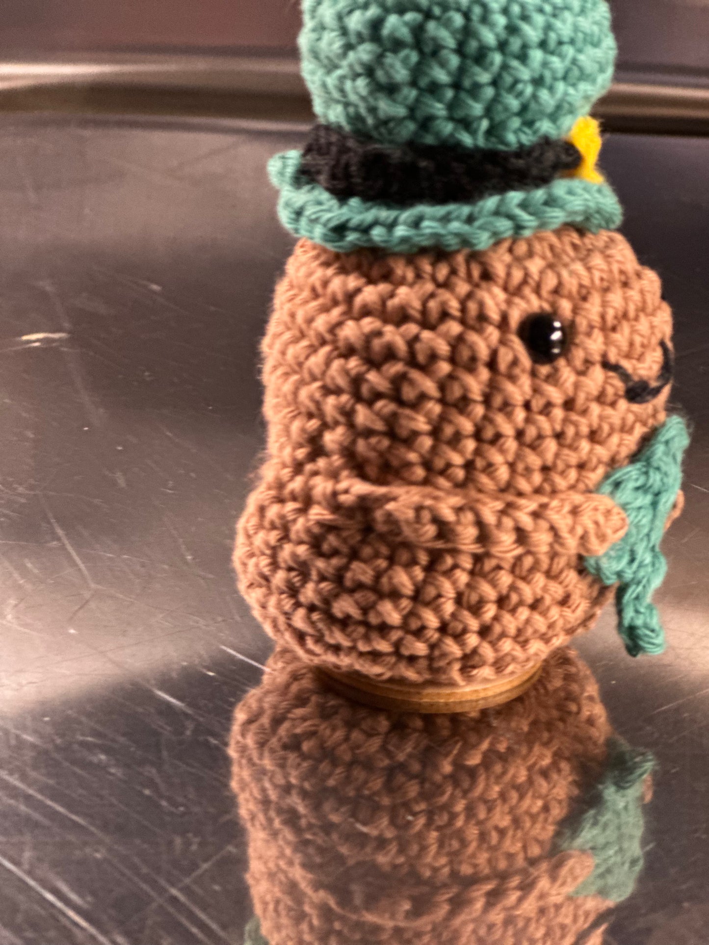 St Patricks Potato with Leprechaun hat and holding a shamrock